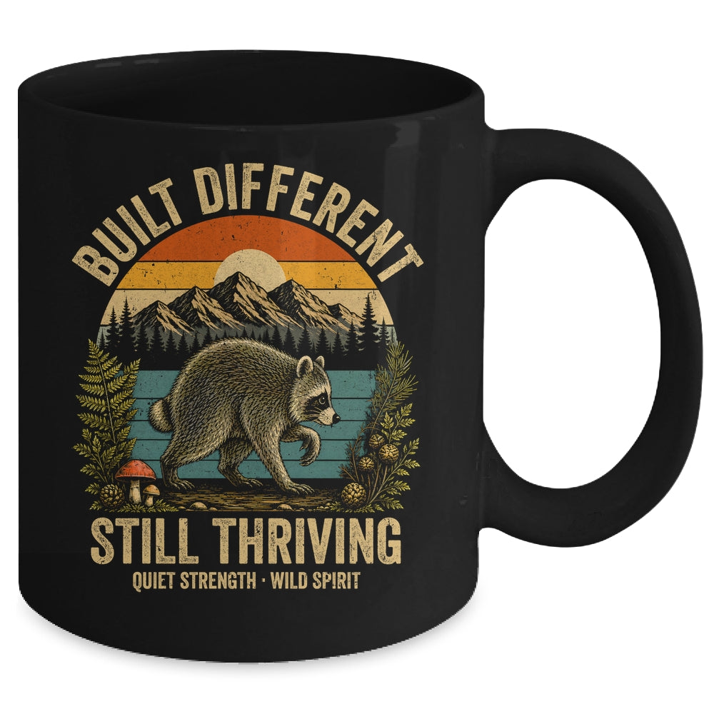 Built Different Still Thriving Raccoon Funny Vintage Mug | teecentury