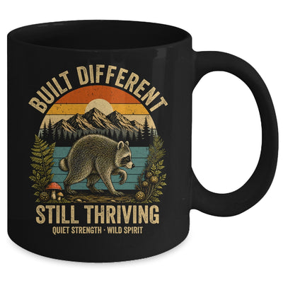 Built Different Still Thriving Raccoon Funny Vintage Mug | teecentury