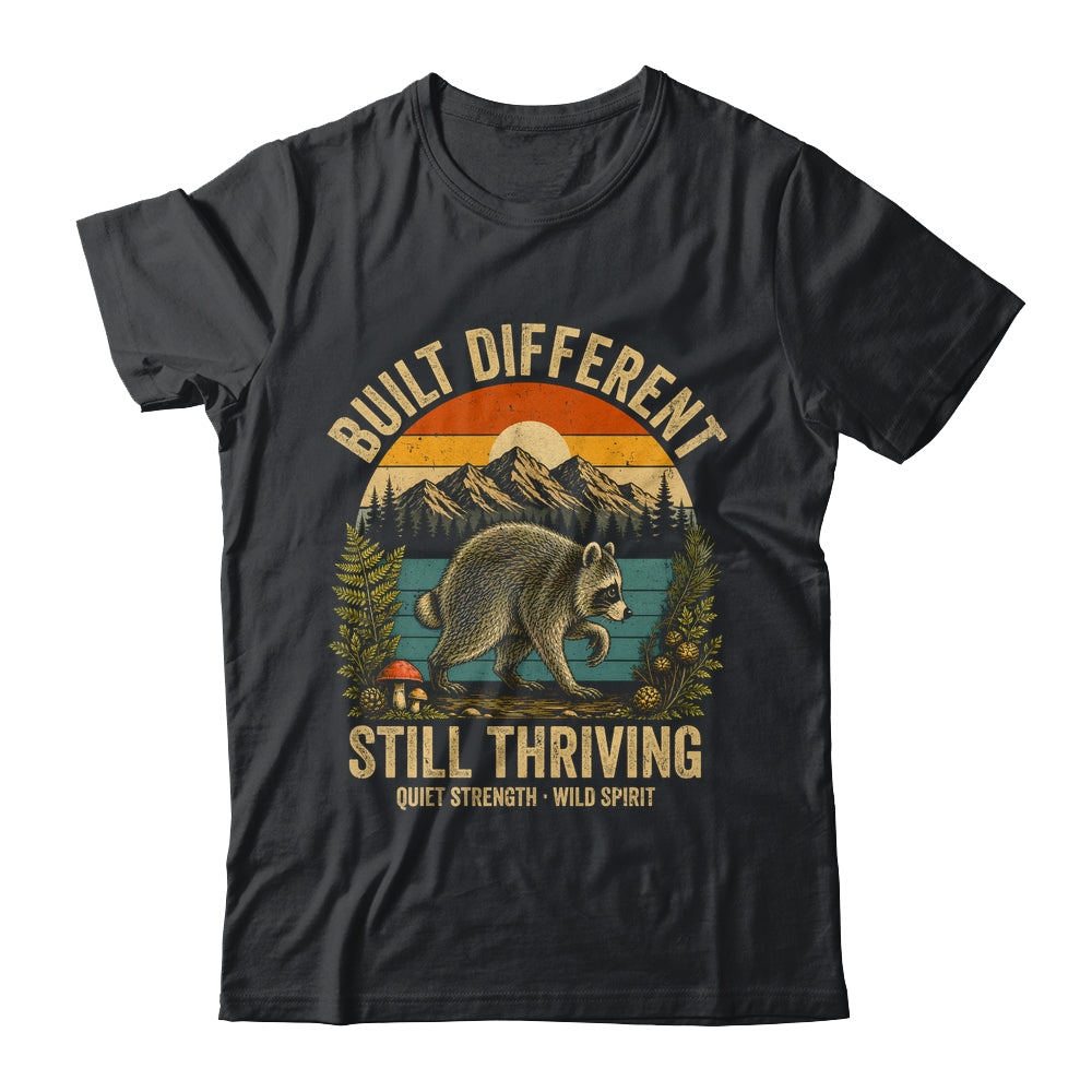 Built Different Still Thriving Raccoon Funny Vintage Shirt & Tank Top | teecentury