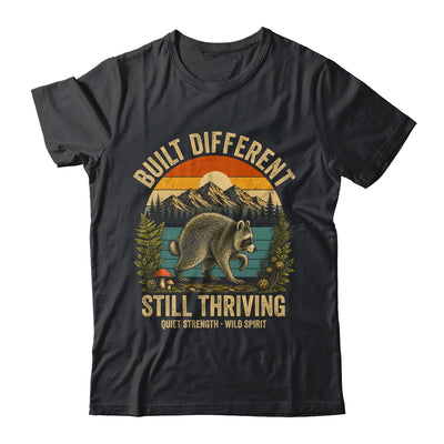 Built Different Still Thriving Raccoon Funny Vintage Shirt & Tank Top | teecentury