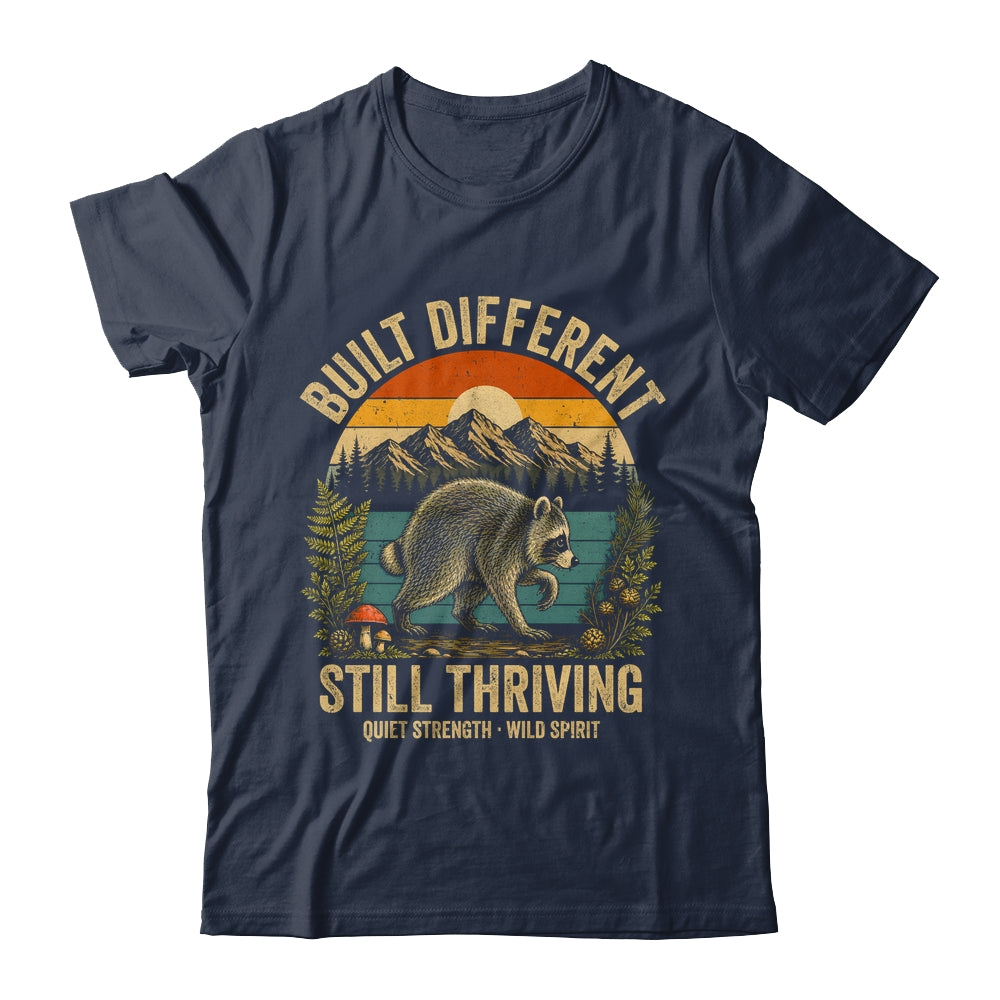Built Different Still Thriving Raccoon Funny Vintage Shirt & Tank Top | teecentury