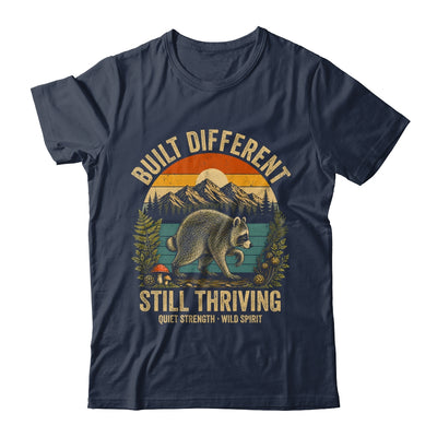 Built Different Still Thriving Raccoon Funny Vintage Shirt & Tank Top | teecentury