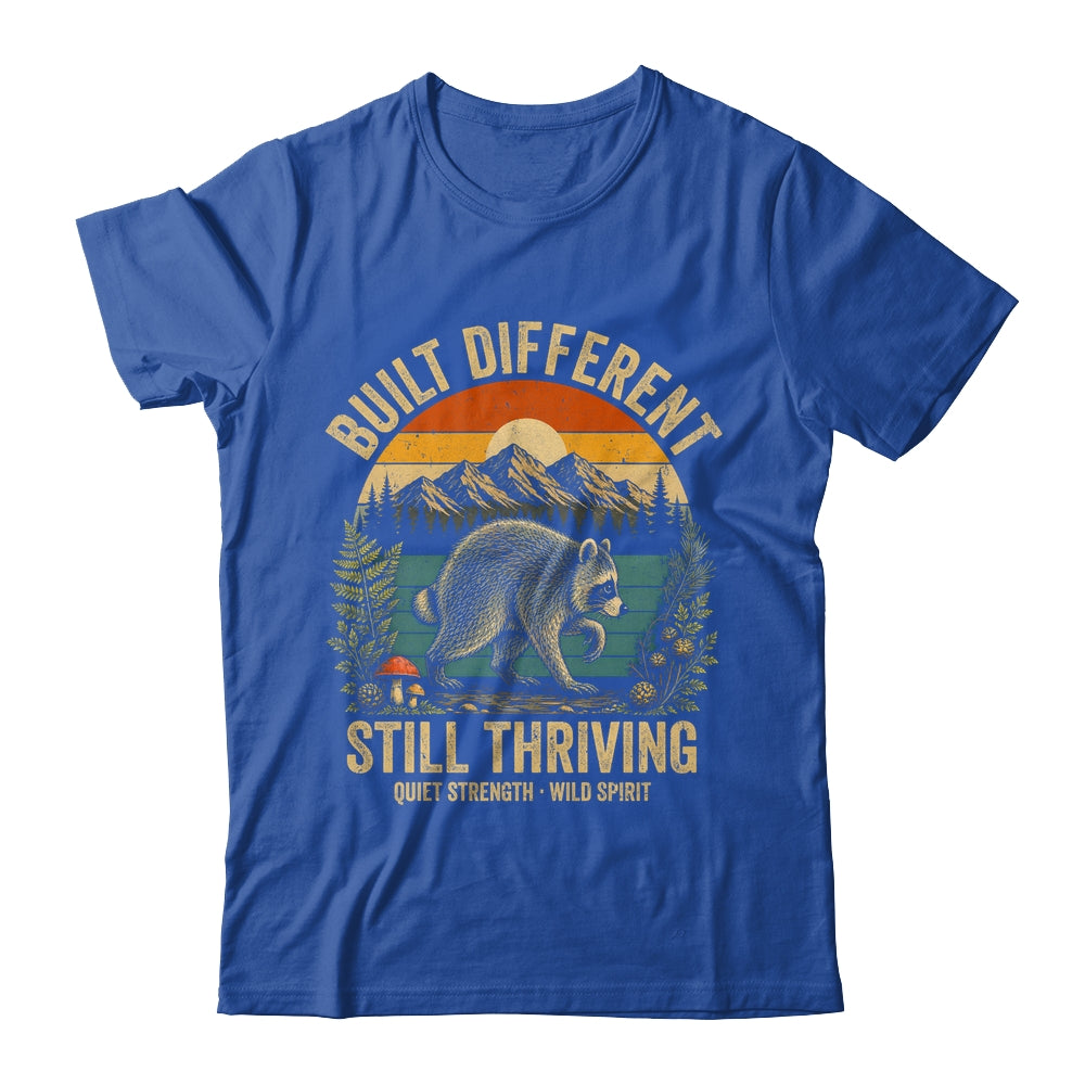 Built Different Still Thriving Raccoon Funny Vintage Shirt & Tank Top | teecentury