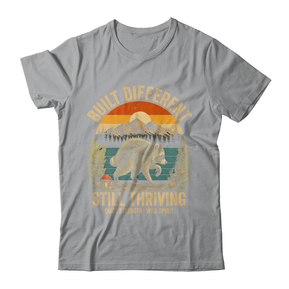 Built Different Still Thriving Raccoon Funny Vintage Shirt & Tank Top | teecentury