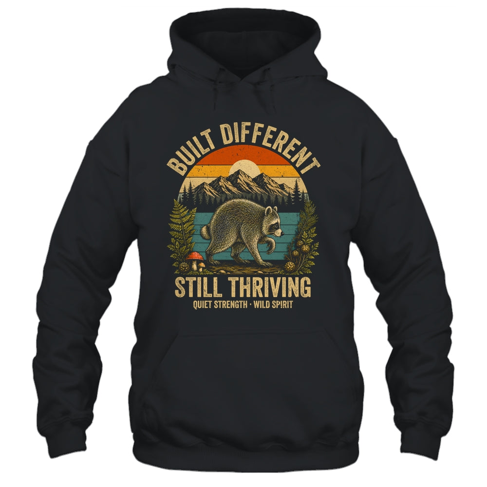 Built Different Still Thriving Raccoon Funny Vintage Shirt & Tank Top | teecentury