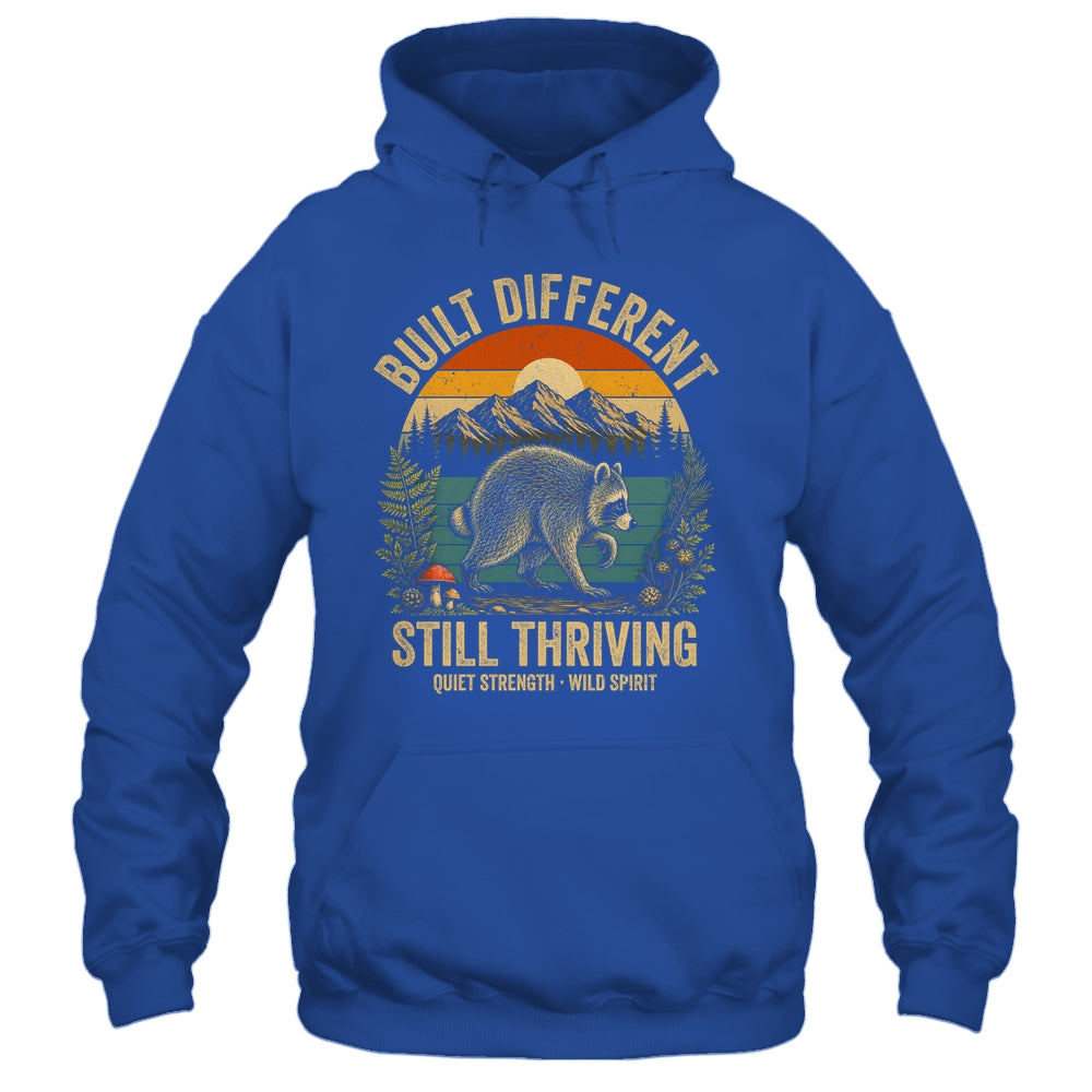 Built Different Still Thriving Raccoon Funny Vintage Shirt & Tank Top | teecentury